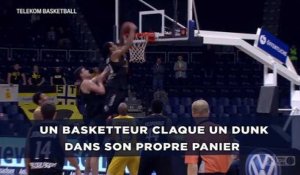 Un basketteur claque un dunk dans son propre panier