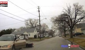 Un suspect agité se débat et traîne un policier au sol avec sa voiture (vidéo)