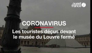 Coronavirus :  les touristes déçus devant le musée du Louvre fermé