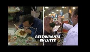 Contre le coronavirus, des restaurants de Hong Kong font manger leurs clients derrière une vitre