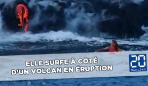 Elle surfe à côté d’un volcan en éruption