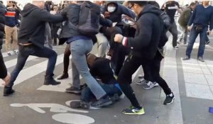 Un Pickpocket tente de voler un téléphone et se fait lyncher pendant la manifestation chinoise à Paris.