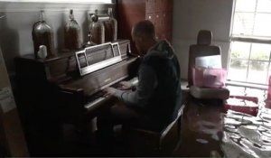 Houston Musician Plays Piano In Flooded Home