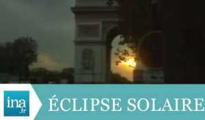 Eclipse solaire sur les Champs-Elysées - Archive INA