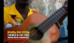 Brushy one string, le gars qui joue de la guitare à une corde