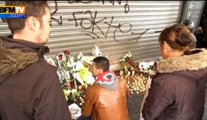 Attentats de Paris: scènes de recueillement devant le Petit-Cambodge à Paris