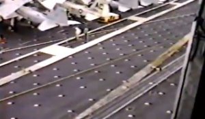 Helicopter dropping of 3 greased pigs on a aircraft carrier!