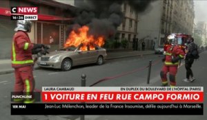 Une voiture en feu rue Campo Formio