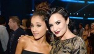 Demi Lovato Celebrates 27th Birthday at Ariana Grande's London Concert | Billboard News