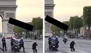 Un policier tape une roue arrière en plein milieu des Champs-Élysées pour une photo
