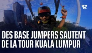 Des base jumpers sautent de la tour Kuala Lumpur en Malaisie