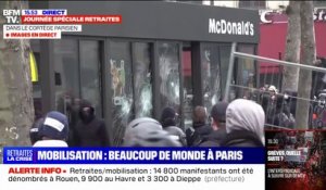 Paris: des manifestants brisent la vitre d'un fast-food