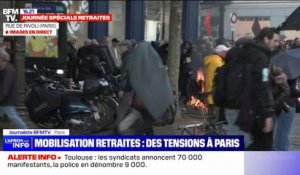 Réforme des retraites: des poubelles incendiées et du mobilier urbain dégradé sur le parcours du cortège parisien