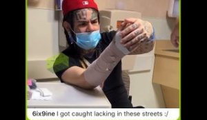 6ix9ine Gets Arm Bandaged Up After Getting Run Up On